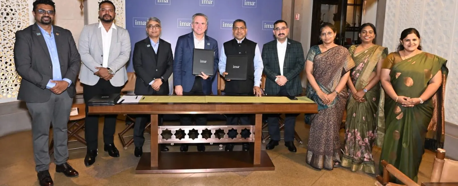 SJCC and IMA representatives at the MoU signing